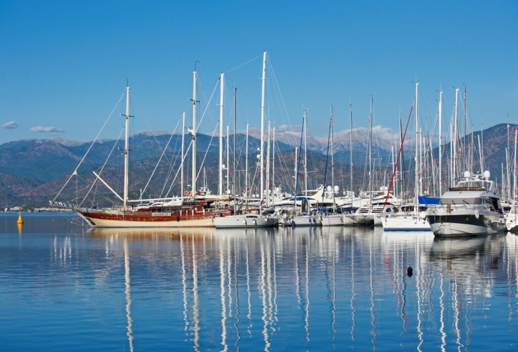 marina at summer day with moored yachts